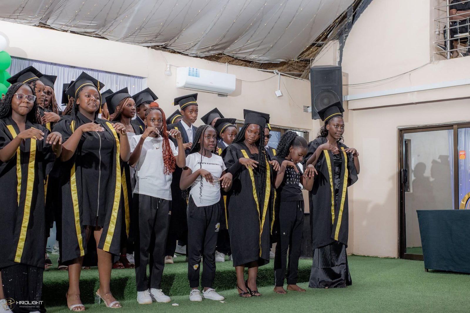 Graduates on stage during the ceremony
